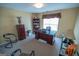 Home office with a desk, chairs, and natural light at 105 Kellens Ct, Fayetteville, GA 30215