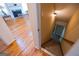 Stairway leading to basement with wooden floors on main level at 105 Kellens Ct, Fayetteville, GA 30215