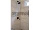 Well-lit bathroom showing a shower with mosaic accents and a modern fixture at 1129 River Green Ct, Mcdonough, GA 30252