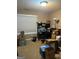 Bedroom with natural light, currently used as an office space with boxes at 1129 River Green Ct, Mcdonough, GA 30252