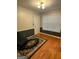 Entryway features hardwood floors, neutral-toned walls with black accents, and a window with wooden blinds at 1129 River Green Ct, Mcdonough, GA 30252