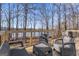 Inviting back deck with comfortable seating, perfect for outdoor relaxation and enjoying scenic views at 84 Contour Dr, Stockbridge, GA 30281
