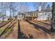 Large backyard with a wooden deck and gray siding, providing ample space for outdoor activities at 84 Contour Dr, Stockbridge, GA 30281