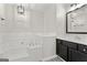 Bathroom featuring a large soaking tub, a tiled backsplash, and a black single sink vanity at 84 Contour Dr, Stockbridge, GA 30281