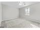 Bright bedroom with a ceiling fan and a large window, offering ample natural light and comfort at 84 Contour Dr, Stockbridge, GA 30281