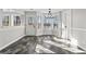 Bright dining area with bay window, modern light fixture, and access to the backyard at 84 Contour Dr, Stockbridge, GA 30281