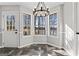 Bright dining area with lake views from the bay windows and a rope light fixture at 84 Contour Dr, Stockbridge, GA 30281
