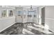 Bright dining area with bay window, modern light fixture, and access to the backyard at 84 Contour Dr, Stockbridge, GA 30281