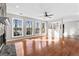 Bright living room with fireplace, built-in shelving, hardwood floors, and natural light at 84 Contour Dr, Stockbridge, GA 30281