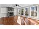 Bright living room with fireplace, built-in shelving, and large windows at 84 Contour Dr, Stockbridge, GA 30281