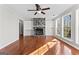 Spacious living room featuring fireplace, built-in shelving, and large windows at 84 Contour Dr, Stockbridge, GA 30281