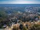 A bird's-eye view showcases the property's location, surrounded by mature trees and neighboring homes at 1355 Compton Woods Dr, Loganville, GA 30052