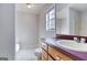 Bathroom featuring vanity with drawers, toilet, tub, and window providing natural light at 1355 Compton Woods Dr, Loganville, GA 30052