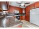 Updated kitchen with wooden cabinets, new appliances, and plenty of counter space for meal preparation at 1355 Compton Woods Dr, Loganville, GA 30052
