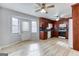 Eat-in kitchen featuring cherry wood cabinets, updated appliances, and a door to the exterior at 1355 Compton Woods Dr, Loganville, GA 30052
