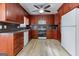Modern kitchen with wooden cabinetry, stainless steel appliances, and ample storage space at 1355 Compton Woods Dr, Loganville, GA 30052