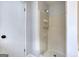 Neutral-toned shower stall in the bathroom, featuring a mounted shower head and organizer at 1355 Compton Woods Dr, Loganville, GA 30052