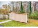 Outdoor storage shed offering space and functionality in a backyard setting at 1355 Compton Woods Dr, Loganville, GA 30052
