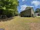 Expansive backyard with ample space for outdoor activities, surrounded by trees and greenery, creating a serene atmosphere at 616 Wallnut Hall Tl, Woodstock, GA 30189