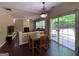 Eat-in dining area featuring hardwood floors, lots of natural light, and access to the backyard at 616 Wallnut Hall Tl, Woodstock, GA 30189