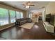 Open living room boasts hardwood floors, lots of light, and a smooth transition into the kitchen at 616 Wallnut Hall Tl, Woodstock, GA 30189