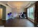 A vibrant living room featuring hardwood floors, modern décor, and lots of natural light at 616 Wallnut Hall Tl, Woodstock, GA 30189
