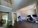A vibrant room featuring a loft space, hardwood floors, gaming chairs, and modern décor at 616 Wallnut Hall Tl, Woodstock, GA 30189