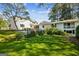 A spacious backyard with lush lawn, patio area, and beautiful landscaping, offering a serene outdoor space at 1664 W Wesley Nw Rd, Atlanta, GA 30327