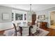 Formal dining room with a chandelier, bay window, and hardwood floors at 1664 W Wesley Nw Rd, Atlanta, GA 30327