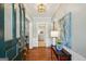 Elegant foyer with hardwood floors, paneled walls, and a glimpse of the kitchen at 1664 W Wesley Nw Rd, Atlanta, GA 30327