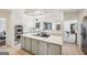 Clean kitchen with white cabinets, large island, and stainless steel appliances at 1664 W Wesley Nw Rd, Atlanta, GA 30327