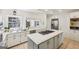 Bright kitchen with white cabinets, quartz countertops, and stainless steel appliances at 1664 W Wesley Nw Rd, Atlanta, GA 30327