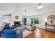 Bright living room with white walls, fireplace, and comfortable furnishings at 1664 W Wesley Nw Rd, Atlanta, GA 30327