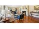 Cozy living room with a fireplace, hardwood floors, and ample seating at 1664 W Wesley Nw Rd, Atlanta, GA 30327