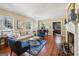 Spacious living room with fireplace, large windows, and hardwood floors at 1664 W Wesley Nw Rd, Atlanta, GA 30327