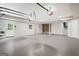 Spacious basement with concrete flooring, utility equipment, and shelving at 760 Swan Ln, Canton, GA 30115