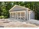 Detached two-car garage with grey siding and white trim at 760 Swan Ln, Canton, GA 30115