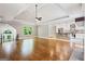 Large living room with hardwood floors that are bathed in light from large windows at 760 Swan Ln, Canton, GA 30115