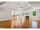 Spacious open concept living room featuring hardwood floors, fireplace, and an open kitchen at 760 Swan Ln, Canton, GA 30115