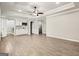 Open-concept living room with a wet bar and wood-look tile flooring at 760 Swan Ln, Canton, GA 30115