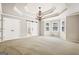 Expansive bedroom with trey ceiling, decorative chandelier, and abundant natural light from multiple windows at 760 Swan Ln, Canton, GA 30115