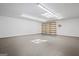 Unfinished storage room with concrete flooring, shelving, and a skylight at 760 Swan Ln, Canton, GA 30115