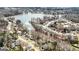 Aerial view of a lakeside community featuring beautiful water and many single-Gathering homes at 261 Lakeview Dr, Locust Grove, GA 30248