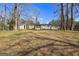 Expansive backyard featuring a storage shed, offering ample outdoor space at 261 Lakeview Dr, Locust Grove, GA 30248