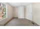 Bedroom featuring carpet, a window bringing in natural light, and white doors at 261 Lakeview Dr, Locust Grove, GA 30248