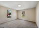 Bright bedroom featuring carpeted floors, natural light and a neutral color palette at 261 Lakeview Dr, Locust Grove, GA 30248