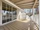 Enjoy outdoor living on this covered deck with sliding glass doors at 261 Lakeview Dr, Locust Grove, GA 30248