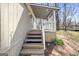 Inviting outdoor patio space with steps down to the lawn at 261 Lakeview Dr, Locust Grove, GA 30248