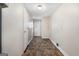 Well-maintained hallway with durable flooring, leading to various rooms and essential utility connections at 261 Lakeview Dr, Locust Grove, GA 30248