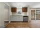 The kitchen features wood-look flooring, an undermount sink, and a stainless steel dishwasher at 261 Lakeview Dr, Locust Grove, GA 30248
